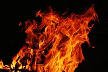 Fire creates infinity shapes when it burns. The orange from the flame and the black backgroud creates interesting textures. Flames from hell. Burning power.