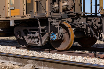 Naklejka premium Freight train cars on railroad tracks. Supply chain, rail transportation and shipping concept
