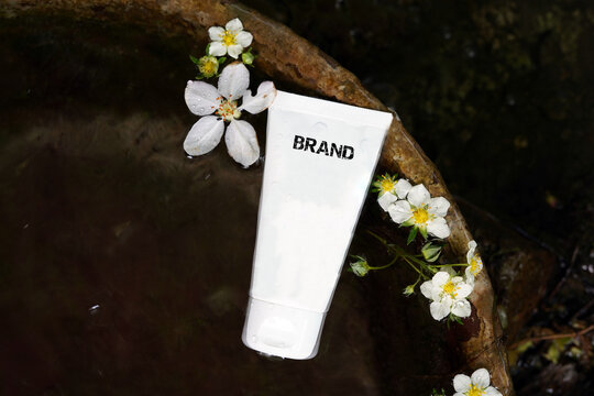 White plastic tube for cream.