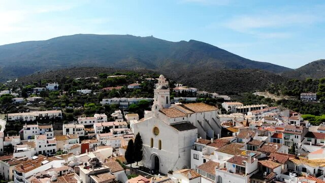 Drone shot Santa Maria de Cadaqu&eacute;s Drone view of a small village on the Costa Brava in Cadaqu&eacute;s. Boats in a rocky bay in Cadaques. View from the drone of the beach and the bay in Cadaques. 