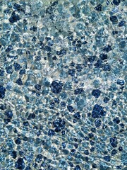 Play of the sunlight on the water surface in the mosaic pool