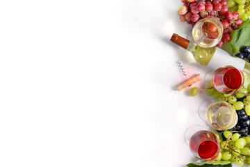 Wine in bottle, wineglasses and grape isolated on white background. Top view