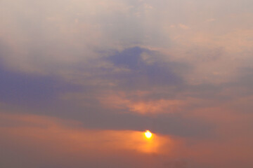 Sunset in a village's sky. Sunset behind the trees. Evening beautiful sky. tree and sun. india