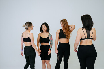 Fototapeta premium diverse models laughing, enjoying time together, look at camera