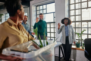 Coworkers greets their female colleague who return to work