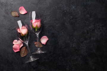Champagne glasses and rose flowers