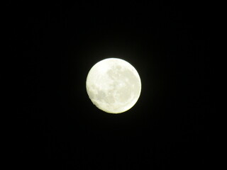 waning moon in a dar sky