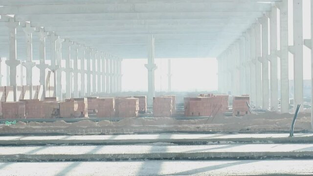 sunlight seeping through the newly built factory concrete