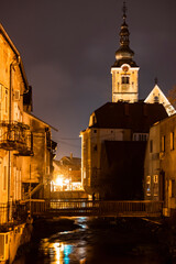 Fototapeta na wymiar Beautiful town of Samobor and its famous wooden bridges and church tower photographed during rainy night