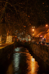 Fototapeta premium Wonderful town of Samobor, located in continental Croatia, during winter, rainy night above Gradna river passing through the city center
