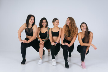 Fototapeta premium diverse models laughing, enjoying time together, look at camera