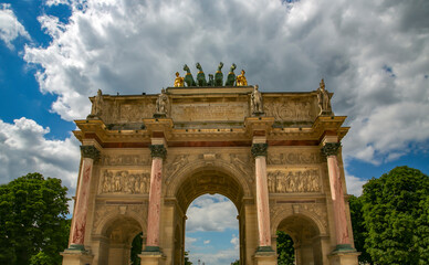 Fototapeta na wymiar Arc de Triomphe du Carrousel or Triumphal Arch at Carrousel Place monument is a tribute to Napoleons military victories in Paris, France