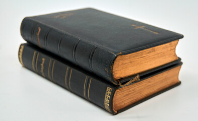 Two antique hymnals in a stack from 1910 and 1914. The edges are finished with real gold. Isolated...
