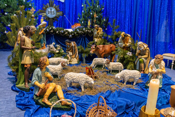 Nativity scene with the image of the Holy Child, the Most Holy Theotokos, St. Joseph, the Magi, a...