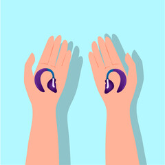 hands holding hearing aid