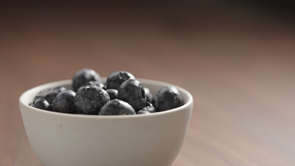 fresh washed blueberries poured into white bowl