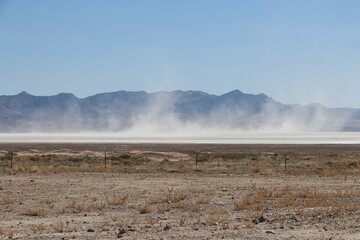 dust storm at the dry lake bed of Sevier Lake in central utah west desert area - obrazy, fototapety, plakaty