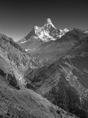 Fototapeta na wymiar Classical black and white landscape with view to valley and mountains peak Ama Dablam in Nepal