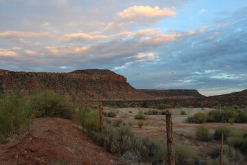 rural fence with barbed wire near st George utah at sunrise