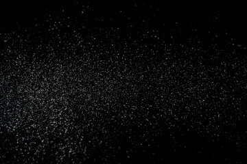  Abstract Snowfall close up on black background  