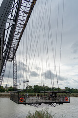 Transporter Bridge over the Charente river under a cloudy sky. National monument. Rochefort sur...