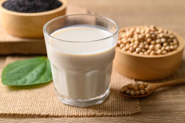 Soy milk with black sesame on wooden background, Healthy drink