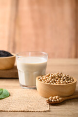 Soy milk with black sesame on wooden background, Healthy drink
