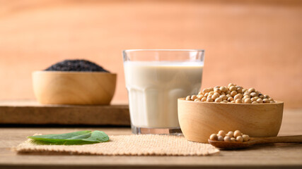 Soy milk with black sesame on wooden background, Healthy drink