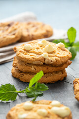White Chocolate Caramel soft baked cookies served with glass of milk