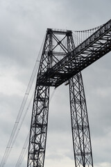 Transporter Bridge over the Charente river under a cloudy sky. National monument. Rochefort sur mer. France