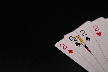 Playing cards showing new year 2022 on an isolated black background. Copy space.