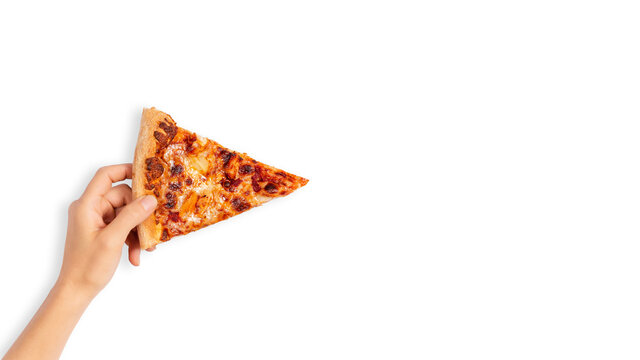 Slice of pepperoni pizza in hand isolated on white. Top view on paperoni pizza. Concept for italian food, street food, fast food, quick bite. Banner with copy space.