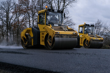 Close up view of a road roller working on a new road construction site.
