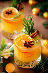 Winter warming bourbon old fashioned cocktail with oranges, cinnamon and rosemary