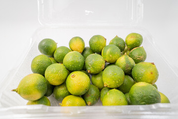 Fresh little limes on pure white background