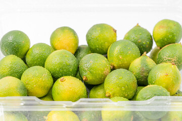 Fresh little limes on pure white background