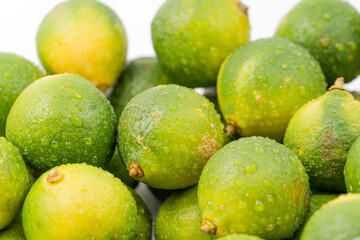 Fresh little limes on pure white background