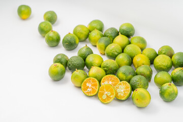Fresh little limes on pure white background
