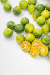 Fresh little limes on pure white background