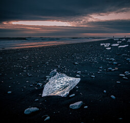 ice on  black sand Diamond Beach in Iceland 