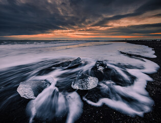 icebergs on the black sand beach called Diamond Beach in Iceland 