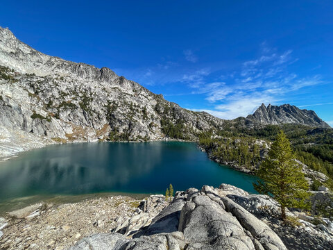 Bright Blue Alpine Lake Surrounded By Granite Mountains