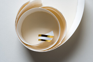 paper curls with gold sticker accents