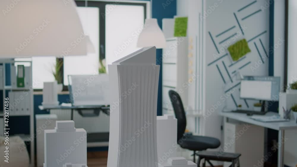 Poster close up of building model and urban structure on table in empty office. construction maquette used 