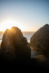 Two big rocks separated by the beach, on a beautiful landscape in Chile, at sunset