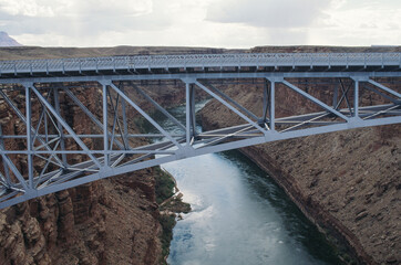 The Silver Navajo Bridge crosses the Colorado River east of the Grand Canyon