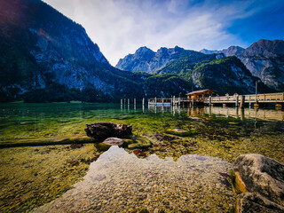 Koenigsee lake in Berchtesgadener valley, view on the lake and boat platform from Mittersee in south of the lake