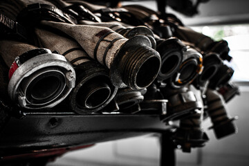 Close up a firefighter historical pipes ready on the truck