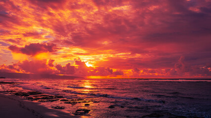 Fiery Sunrise over Sunset Beach in North Shore Oahu, Hawaii - obrazy, fototapety, plakaty