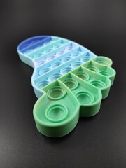 Photo of pop it toys for kids isolated on black background, Not Focus